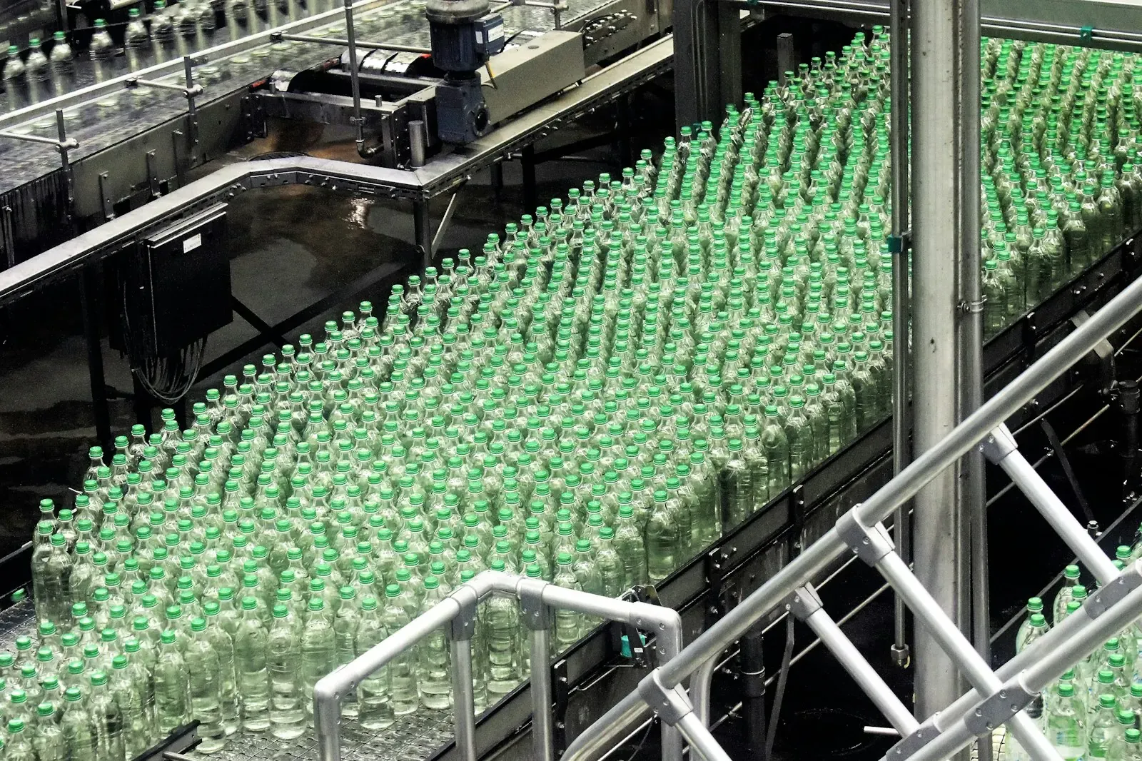 A bottling conveyor line: bottles of liquid in production